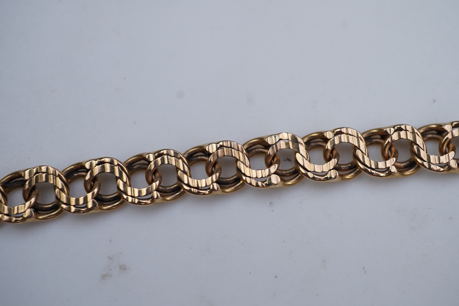 Two gold bracelets and a gold necklace